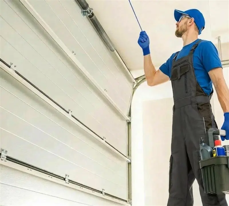 Man Fixing an Garage Door in Buford GA