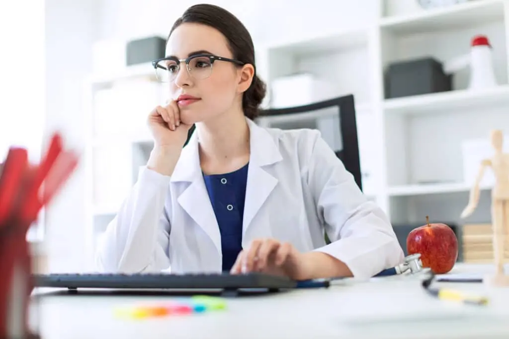 Oral and maxillofacial surgeon in her office