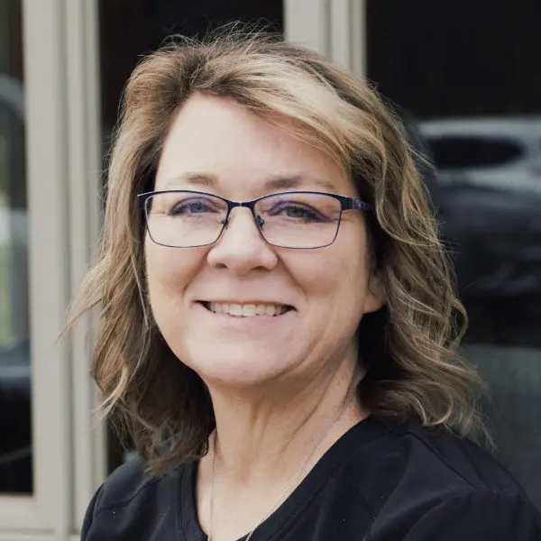 April, Financial and Insurance Coordinator, smiling headshot