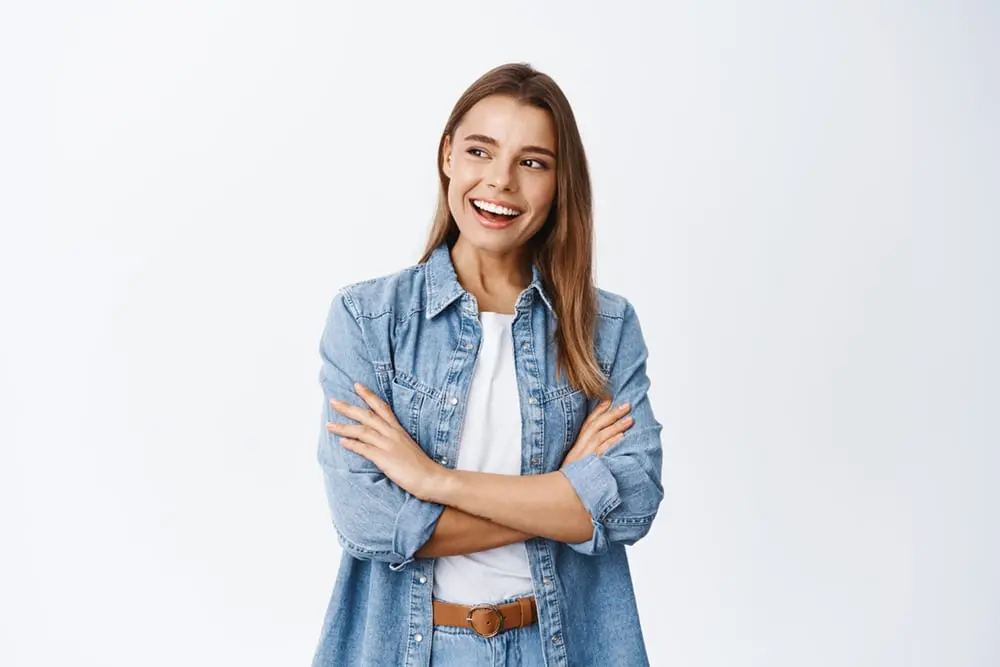 Woman smiling showing her perfect teeth with dental crowns