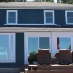 : Home exterior with new roof, siding and windows
