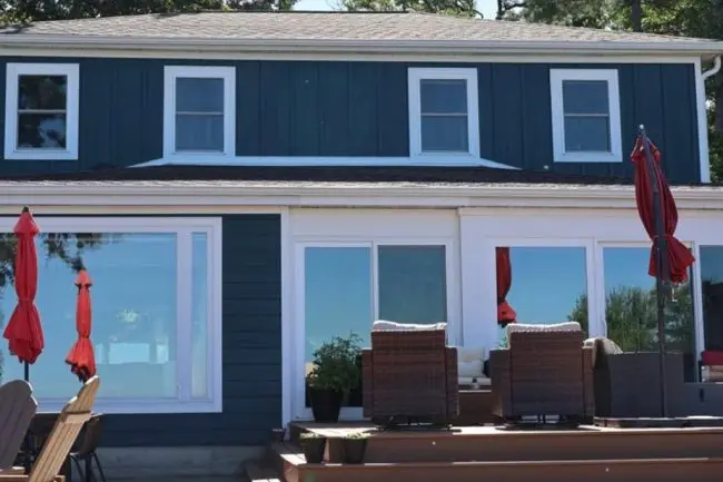 : Home exterior with new roof, siding and windows