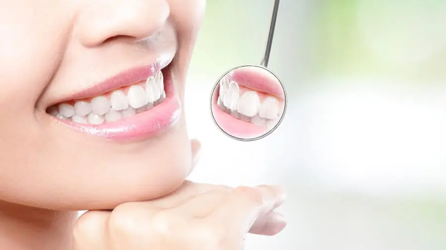 stylized dental patient smiling with mirror