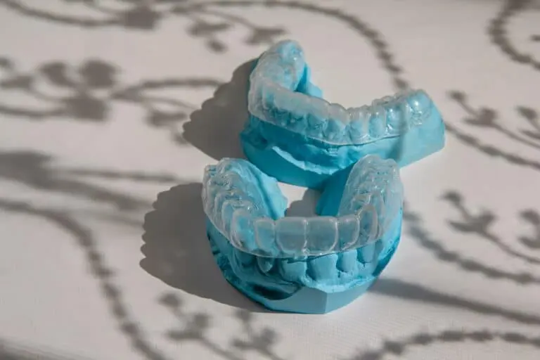 Blue nightguard appliance on dental model.