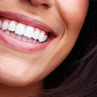 Home 3 A person displaying a bright, white smile.