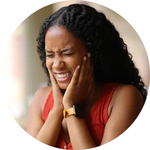 Home 5 A person holding their jaw with both hands in pain.
