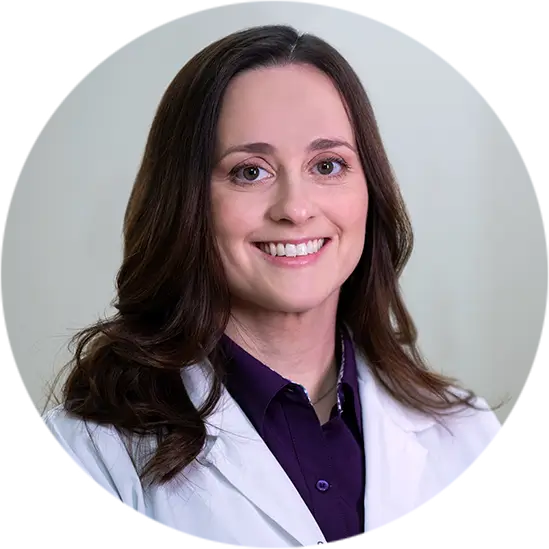 Home 8 Female dentist in white coat smiling in headshot – General Dentistry in Westbury, NY – Smallberg & Satornino, DDS, PLLC