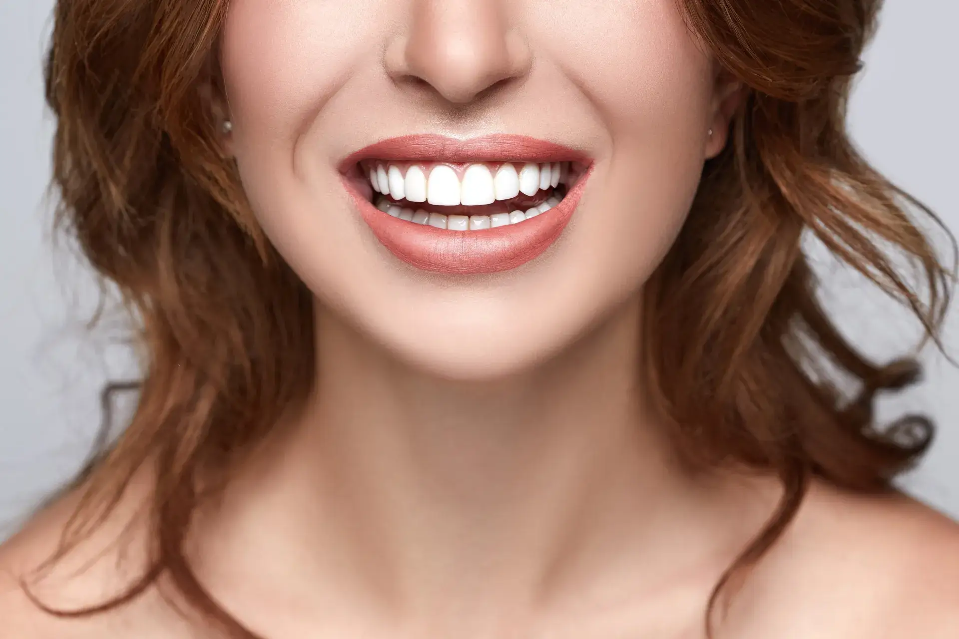 Teeth Whitening 1 Woman smiling with straight white teeth – Cosmetic Dentistry in Westbury, NY – Smallberg & Satornino, DDS, PLLC