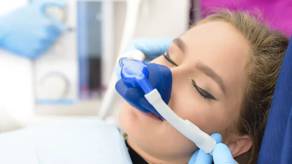 Female dental patient undergoing sedation