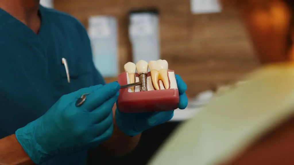 Closeup of a dentist explaining dental reconstruction