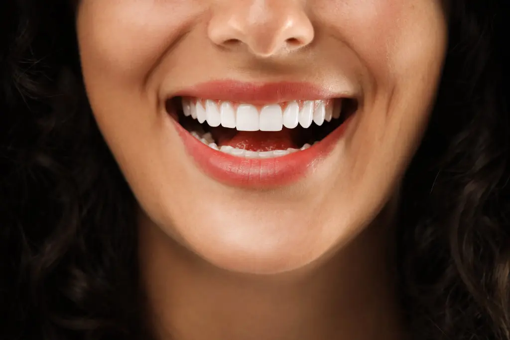 Female dental patient smiling after visiting a cosmetic dentist in Vancouver