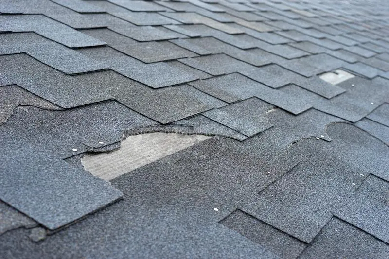 Missing and broken shingles residential roof damage