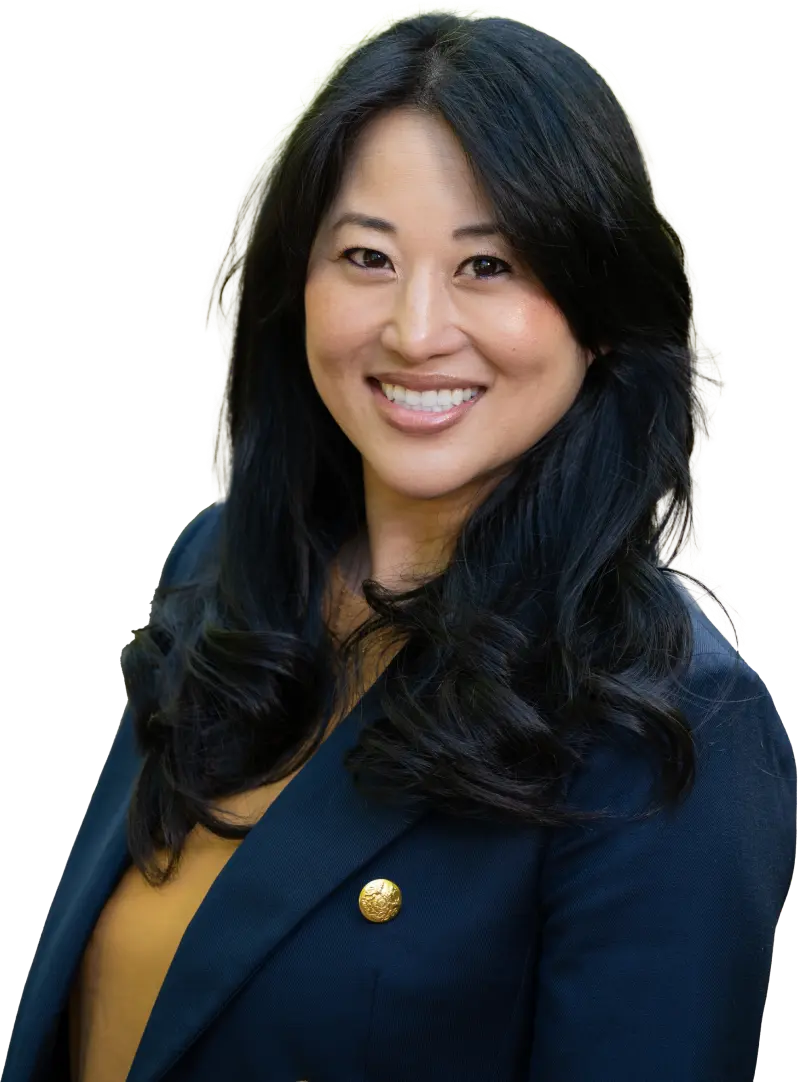Head shot of Dr. Oh wearing a blue dark blazer and yellow blouse