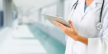bigstock Doctor Using Tablet Computer A 265913938