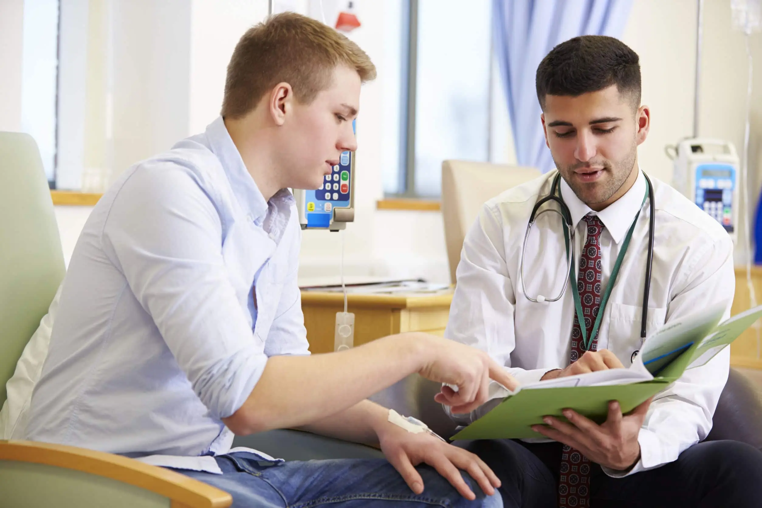 A doctor discussing medical records with a patient in a hospital