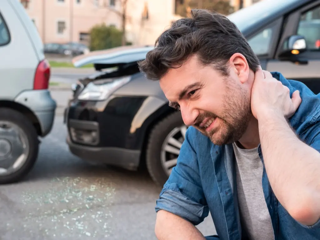 Man holding his neck after a car accident