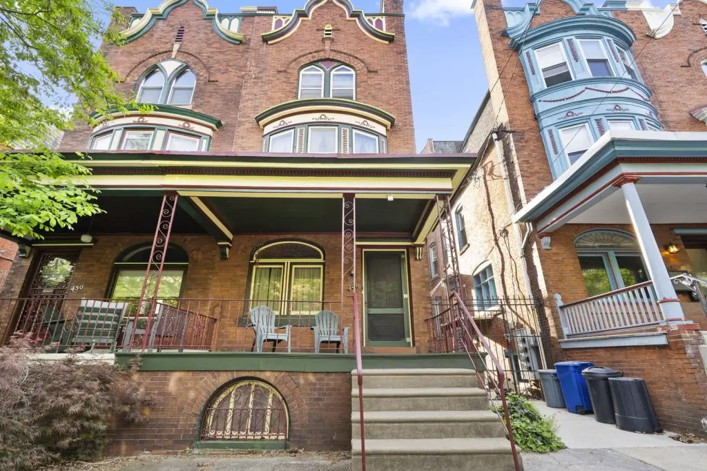 How Late in the Fall Can You Paint Your House Exterior in Philadelphia? 1 Freshly painted porch trim and windows on a brick rowhouse in Philadelphia