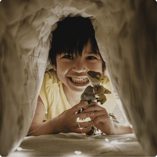 child under blanket