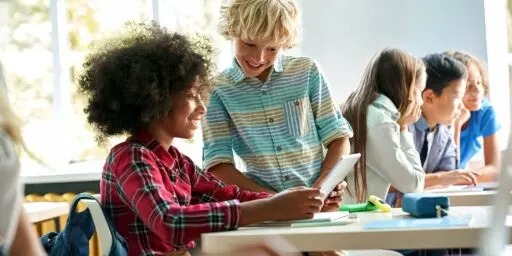 uylc hero kids in classroom