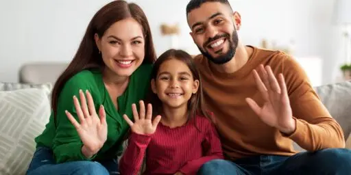 uylc hero family waving on couch