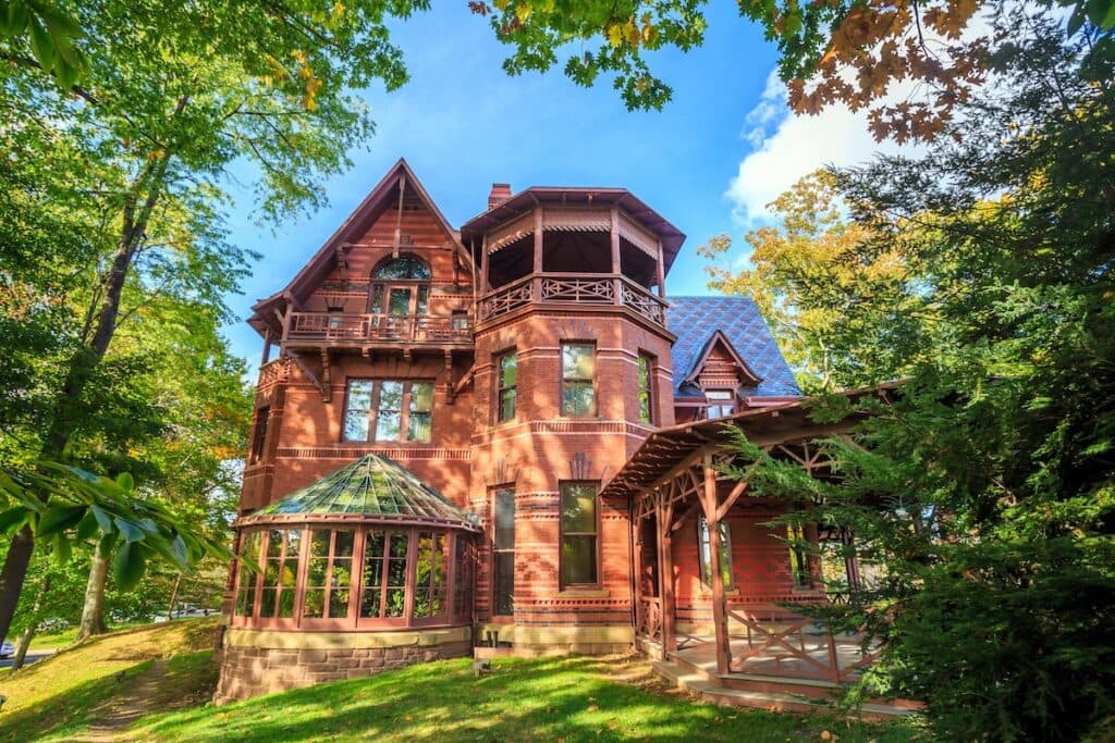 historic house with tile roofing
