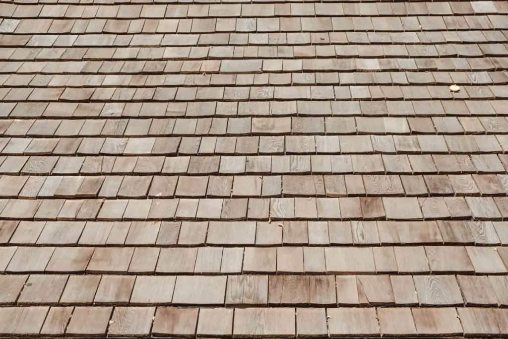 close-up of a newly repaired cedar shake roof