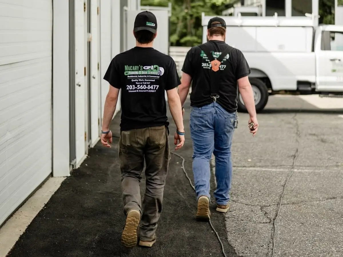 emergency plumber cost plumbers walking on the street
