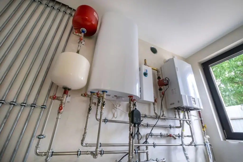 Heating system installation in modern residential space with water heater and piping system