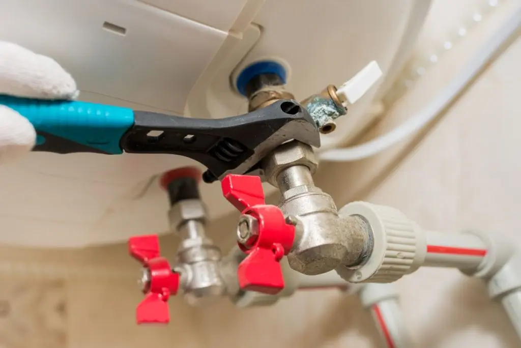 boiler water heater with a plumbing wrench