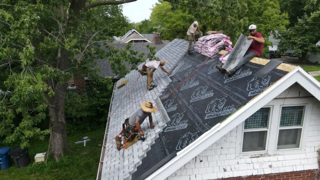 First Fruits Construction team working a roof, wearing safety harnesses