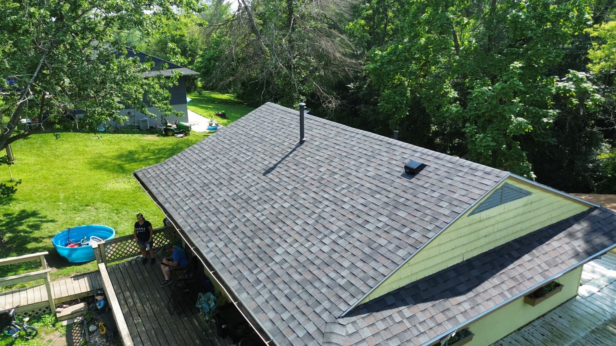 Aerial view of a newly installed grey shingle roof