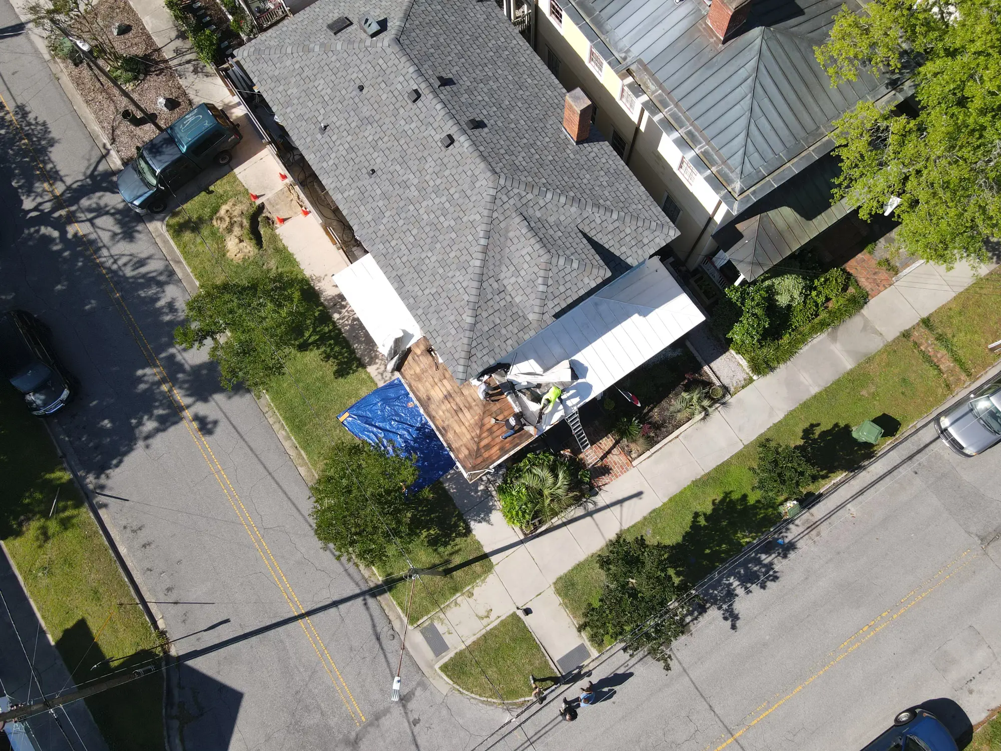 roofing crew replacing house roof