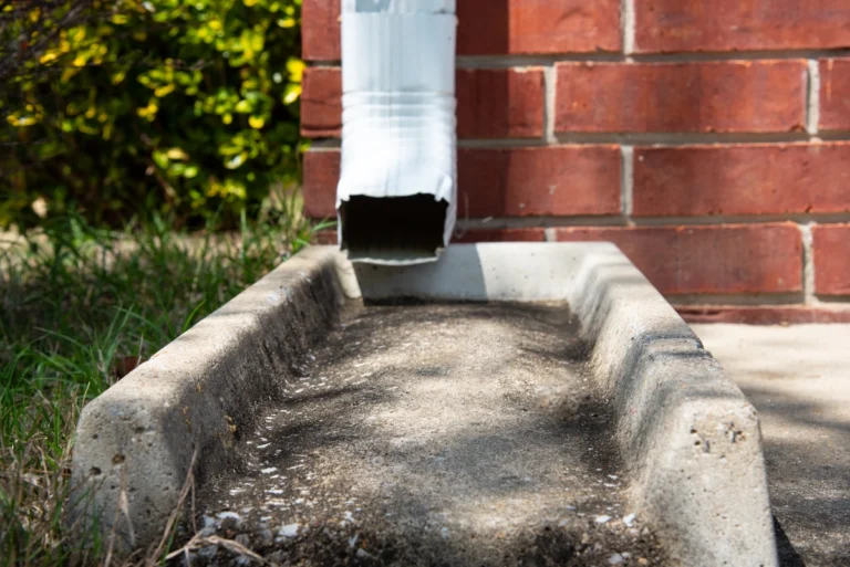 how to clean downspouts