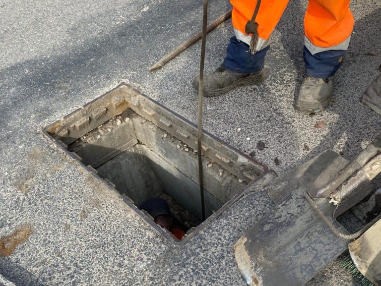Cleaning storm drains from debris, clogged drainage systems are cleaned with a pump and water