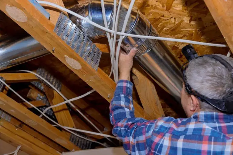 guy inspecting ductwork