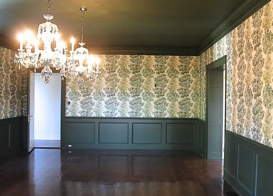 Dining room, freshly redone with tree-pattered wallpaper and dark green wainscoting and a dark green ceiling. Wallpaper and paint completed by Lauro Painting in the Greater Philadelphia area.