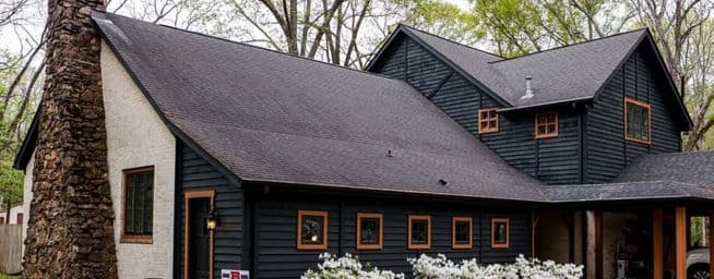 dark solid stain on cedar siding using Benjamin Moore woodluxe