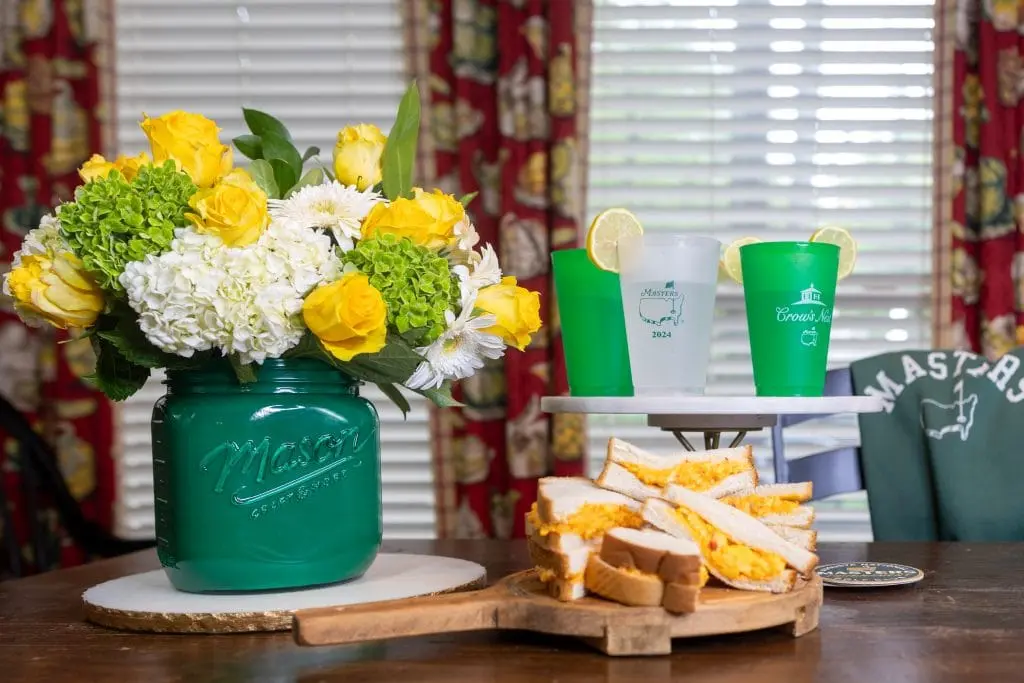 Augusta Pimento cheese sandwich and lemonade with masters green vase