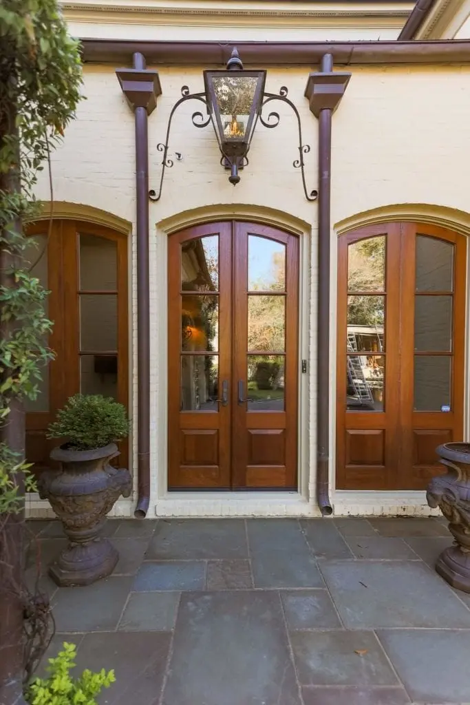 double wood front door set stained in a medium brown general finishes exterior stain