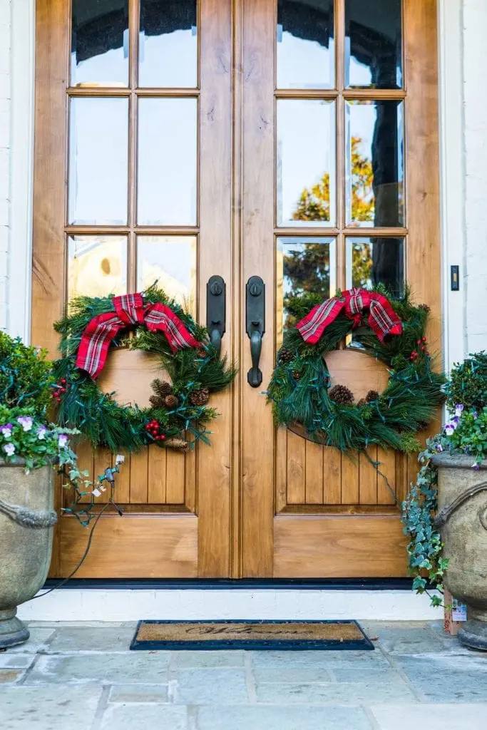 Wood front doors refinished with general finishes exterior 450 stain and clear coat system with Christmas decorations