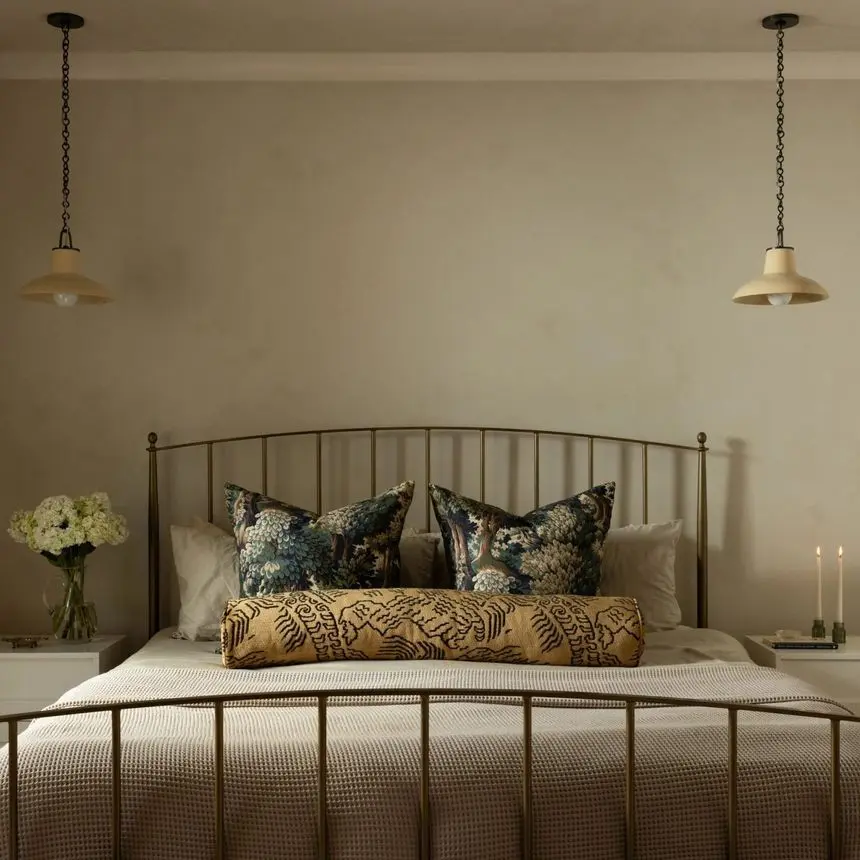 Limewash bedroom primary suite with JH Lime Wall Paint No. 107 greige walls brass bed and soft pendant lighting