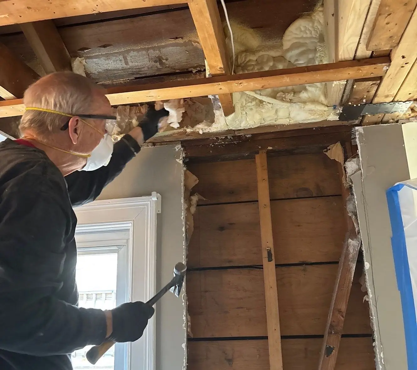 Water damage restoration worker