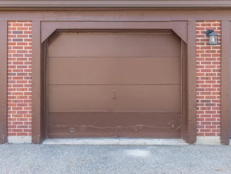 A garage door with a dent