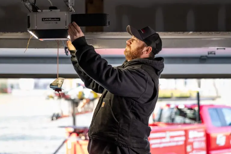 Genson worker fixing garage door