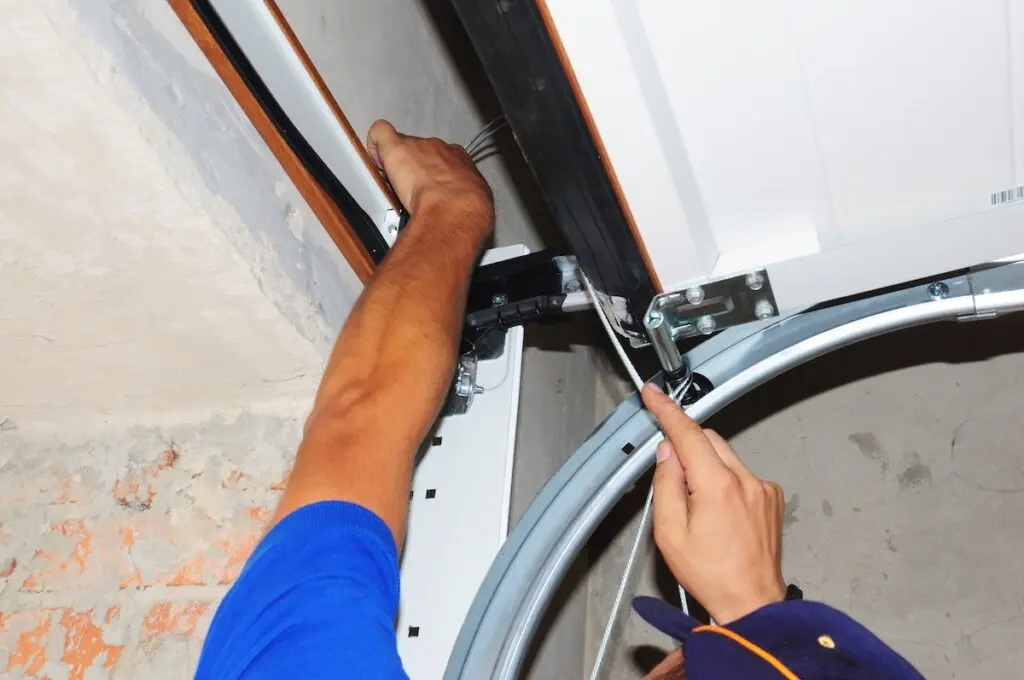 Contractor repair and install garage door. 