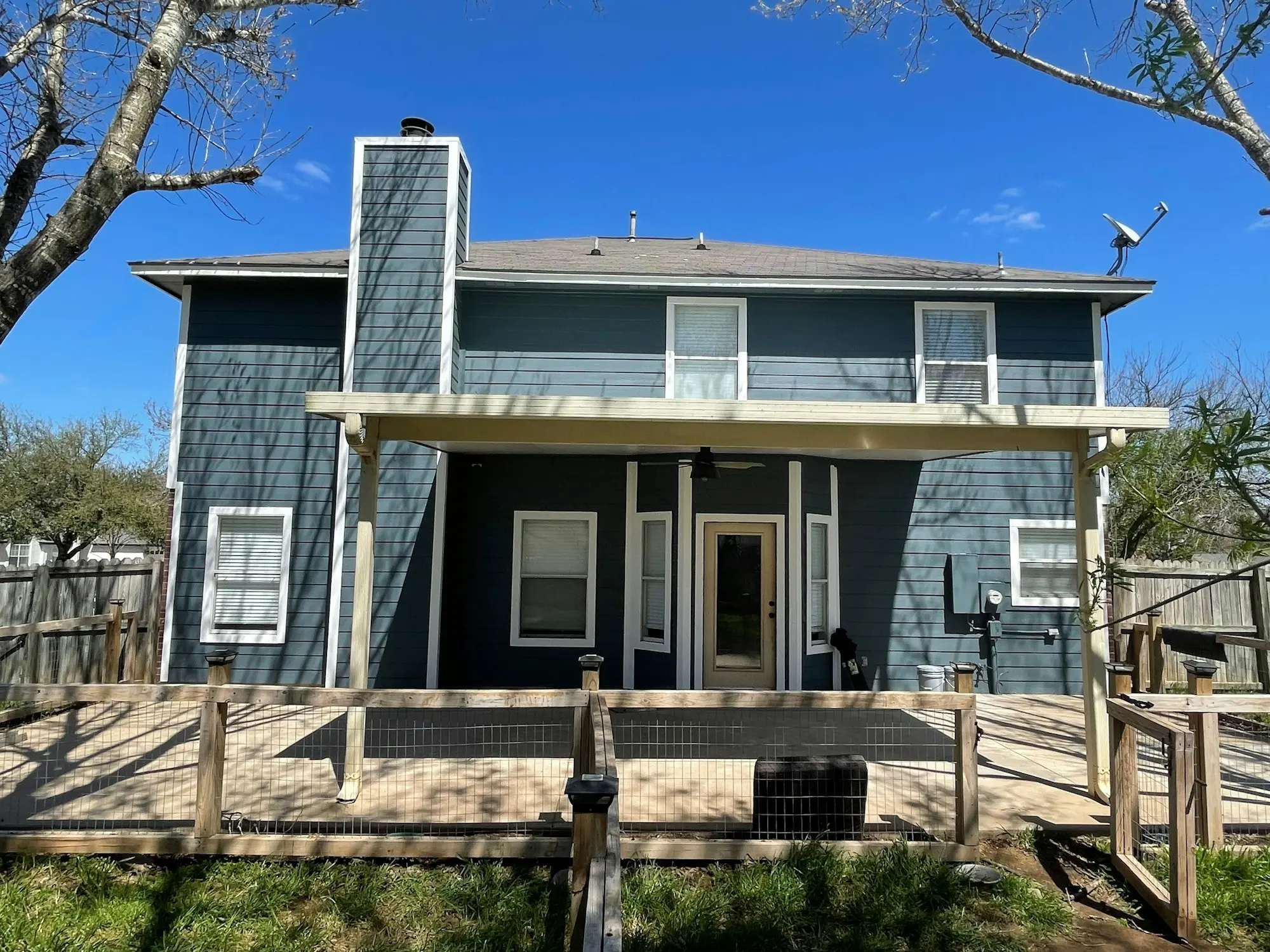 Two-story home with blue lap siding