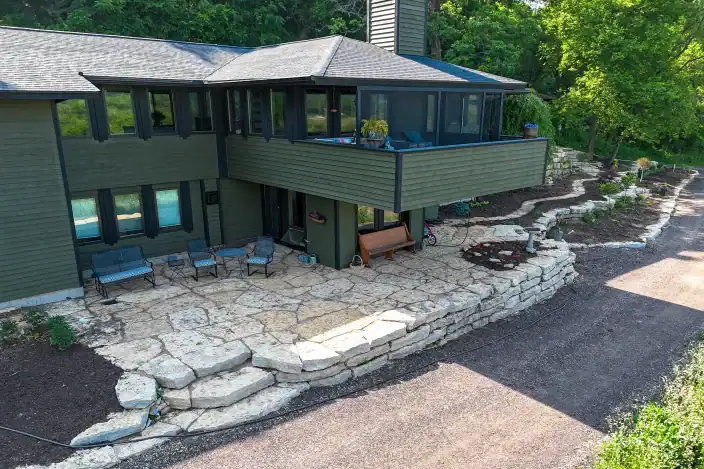 Trusted Landscaping Company Serving Madison, WI 12 Beautiful stone patio and landscaping in Madison, WI residential backyard.