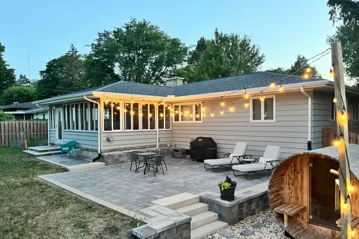 Trusted Landscaping Company Serving Madison, WI 16 Beautiful backyard patio with outdoor seating and string lights in Madison, WI.