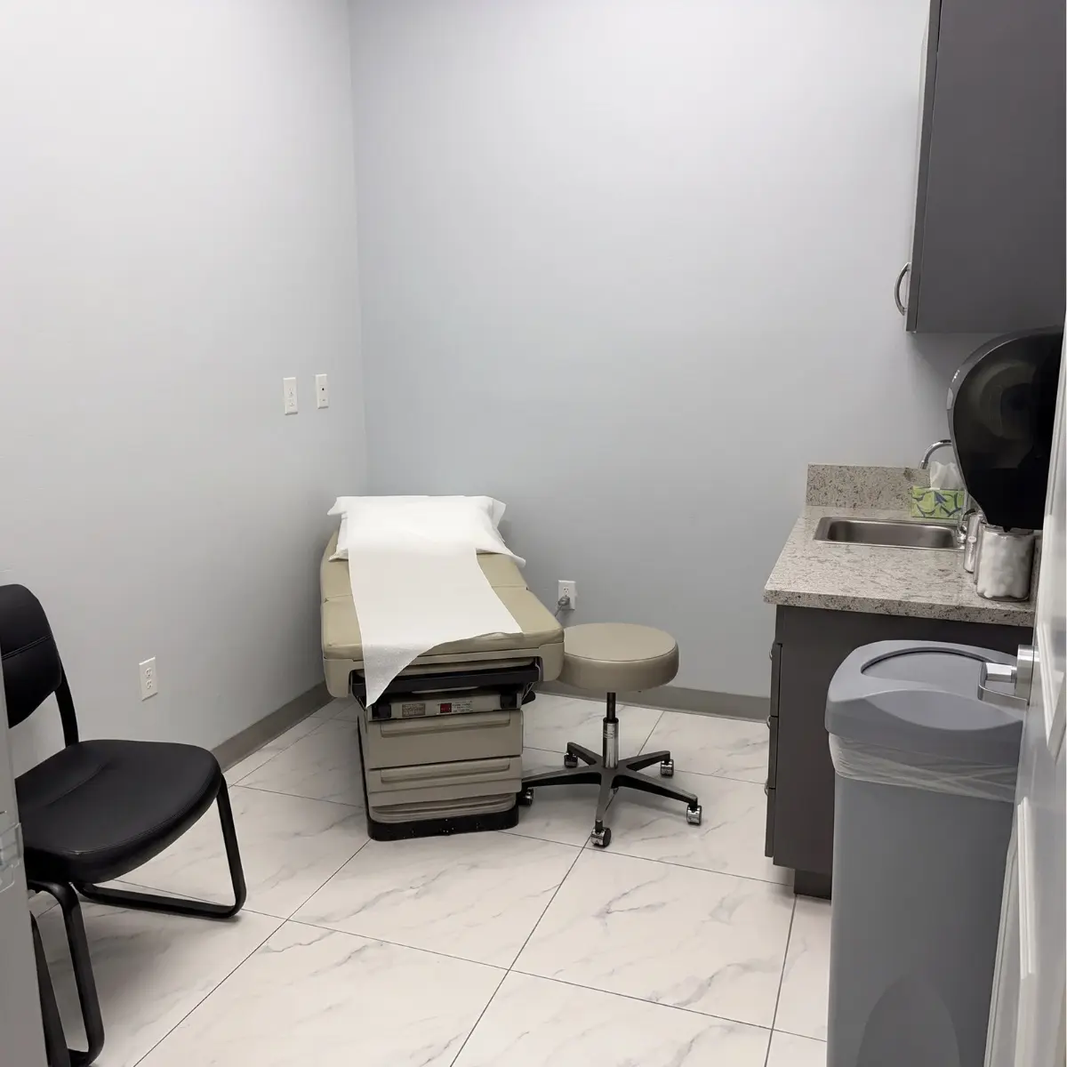 Exam room with treatment table at the Coffee Road clinic